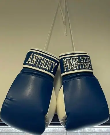 boxing gloves that read "Anthony- never stop fighting"